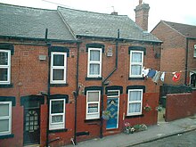 With no rear yard, across-street washing lines are employed with a pulley operated from street level. Back to backs with washing.jpg