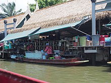 Waterfront eateries and way of life of the people one will see when cruising along the various canals of Bangkok Bangkok along the Chao Phraya and Wat Arun (15068293155).jpg