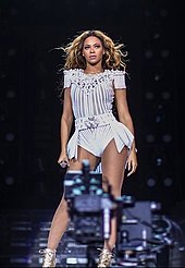 Beyoncé performing during The Mrs. Carter Show World Tour in 2013. The tour is one of the highest grossing tours of the decade.