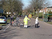 A "lollipop lady" in Bournemouth, England Bournemouth , Moore Avenue and Lollipop Lady - geograph.org.uk - 1746368.jpg