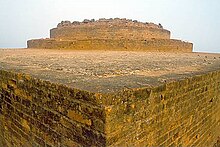 Corner of light-coloured, angular stone ruins