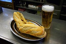 Squid sandwich (bocadillo de calamares) with beer Cana y Bocadillo 0628.jpg