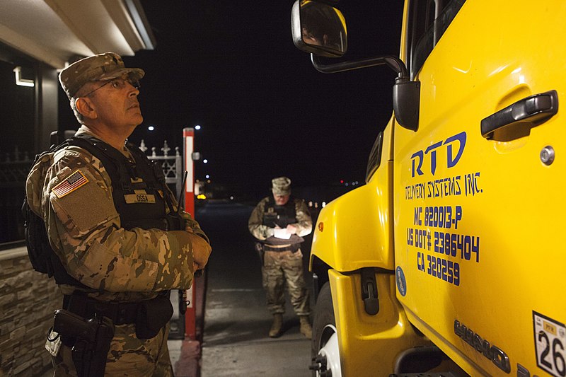File:California State Military Reserve Spc. Juan Ossa, of the Installation Support Command, talks with a truck driver.jpg