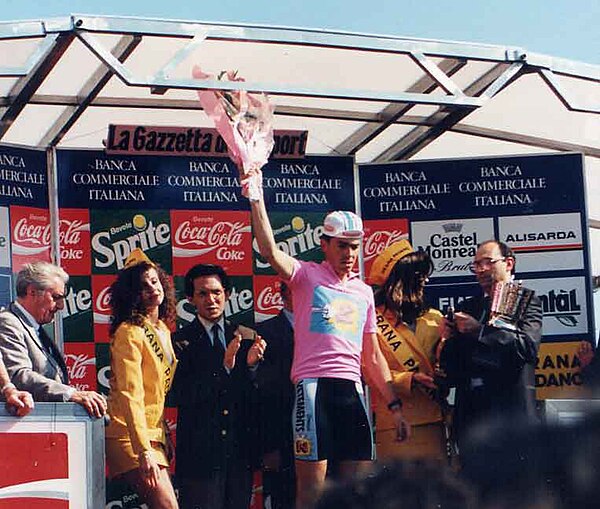 Z's Philippe Casado shown after being presented with the race leader's maglia rosa (English: pink jersey) from winning the race's opening leg