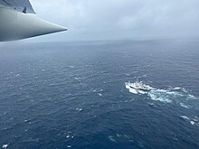 U.S. Coast Guard HC-130 flying over L'Atalante on 21 June Coast Guard HC-130 and L'Atalante searching for Titan.jpg