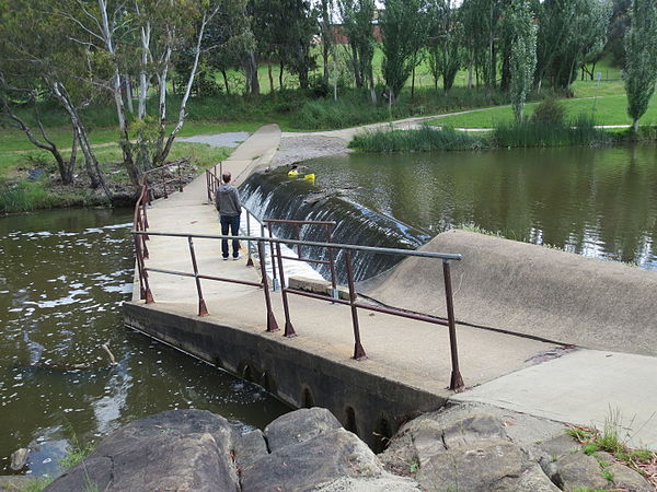 A weir on the Yass River, New South Wales, Australia, directly upstream from a shared pedestrian-bicycle river crossing