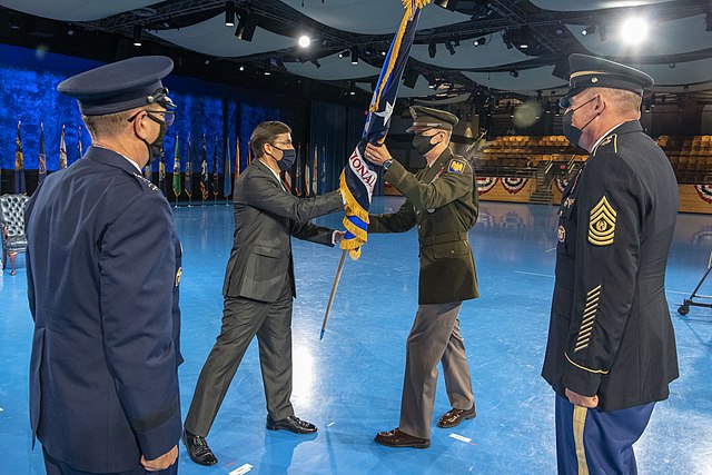 General Daniel R. Hokanson, incoming chief of the National Guard Bureau, receives the NGB command guidon from Secretary of Defense Mark Esper on Augus