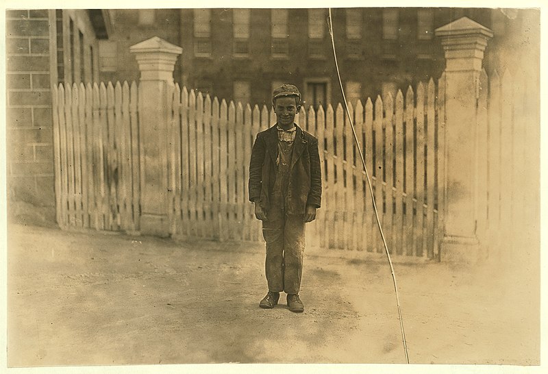 File:Donimeco Cipella works in he card room of the Natick Mills, Natick, R. I. Has been there 2 years. 'Once dey made me stop and said I should go to school but I'm workin' again.' Does he look LOC cph.3b46696.jpg