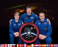 v.  ik.  Rechts: Anne McClain, Oleg Kononenko (commandant) en David Saint-Jacques