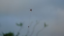 Helicopters fighting fire in Whitireia Park in 2010 FIRE! Helicopter water bombers called in to dowse flames of a major bushfire in Titahi Bay, New Zealand -b.jpg