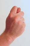 The "fig sign" is an ancient gesture with many uses. Gesture fist with thumb through fingers.jpg