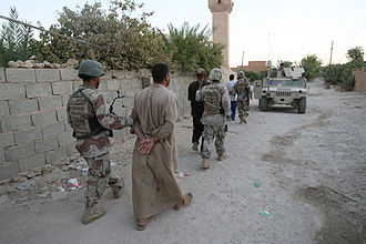 An Iraqi soldier detains a suspected insurgent during Operation Guardian Tiger IV. Guardian Tiger IV (1).jpg