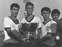 Israeli teammates (Mordechai Spiegler in the middle) holding the 1964 AFC Asian Cup after beating South Korea in the final round Israel soccer team holding Asian cup 1964a.jpg