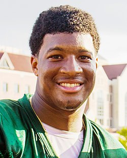 A picture of Jameis Winston while shaking someone