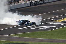 Johnson performing a burnout at the 2017 O'Reilly Auto Parts 500 Jimmie Johnson Texas Win 2017.jpg