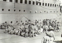 Troops of the Second AIF at Bombay 25 March 1942, waiting to embark aboard Katoomba to Australia Katoomba Bombay-25 March 1942.png