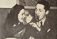 Kitty Kallen and Leonard Feather swap Armenian vittles, 1945.jpg