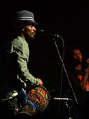 K'naan (pictured) co-wrote the track Knaan in Ottawa 2007.jpg