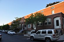 Rear of a typical housing row in the district ManchesterNH DistrictC HousingRow 02.jpg