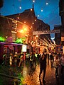 Mathew Street in the rain at dusk - MATHEW STREET, BIRTHPLACE of THE BEATLES, written on a message banner of north side entrance, near REISS and Elle, Liverpool (2011-08-06 21.26.23 by SomeDriftwood).jpg