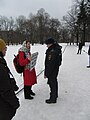 Mothers' rally. St. Petersburg, 2019-02-10. Police officer interviews a protester.