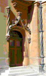 This Renaissance Revival doorway illustrates a Gothic influence on French Renaissance design. A basket-handle portal is surmounted by a floral ogee hood moulding. Neorenaissancedoor.gif