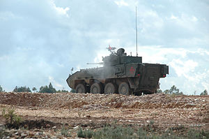 A Portuguese Army Pandur II with an SP30 turret with 30 mm gun. Pandur 8x8 Wheeled Armoured Personnel Carrier, Trident Juncture 15 (22525568331).jpg