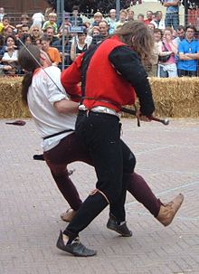 15th century German longsword demonstration at Furor et Ferrum 2007 (the action is the final stage of a "going-through" with a throw). Pavone07 Freywild Wurf.jpg