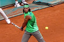 Nadal hits a backhand at the 2008 French Open