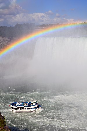 A boat of the canadian company Hornsblower on the Niagara river, next to the Horseshoe Fall (Niagara Falls, Ontario, Canada)