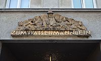 Domovní znamení „Zum Wassermännlein” (U vodního mužíčka) od Otto Hofner (Wien, Rechte Wienzeile 71)