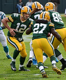 Rodgers handing the ball off to running back Eddie Lacy in 2014 Rodgers handing off 2014.jpg