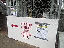 A sign barricading the entrance to the Nassau station, directing passengers to the new Arthur Kill station Sign blocking the entrance to the now-closed Nassau stop on the Staten Island Railway.jpg