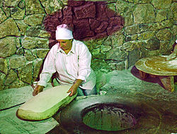 Traditional lavash bread making (5211763362).jpg