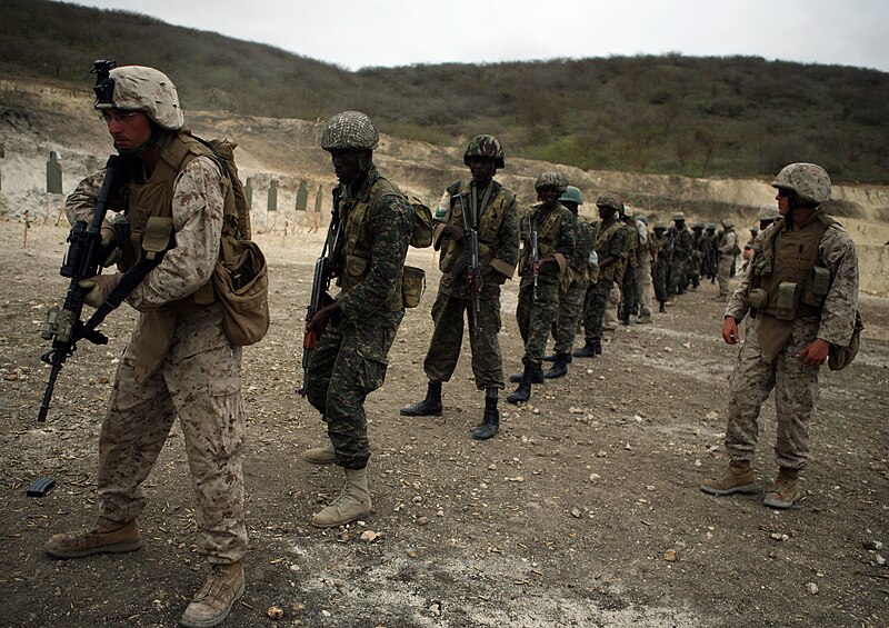 File:U.S. Marine Corps Lance Cpl. Jason R. Demopoulos, left, a rifleman with the 3rd Battalion, 25th Marine Regiment, lines up among Gambian soldiers to demonstrate shooting from the pivot July 15, 2012, in Thies 120715-M-XI134-1825.jpg