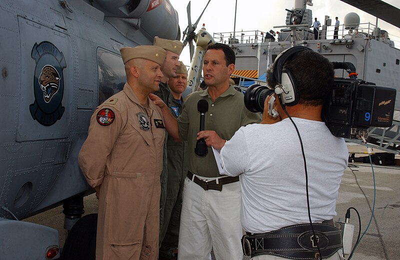 File:US Navy 070622-N-1810F-008 Lt. Cmdr. Juan Gutierrez, assigned to Helicopter Antisubmarine Squadron Light (HSL) 46, talks to "Fox & Friends" co-host Brian Kilmeade about the SH-60 Seahawk.jpg