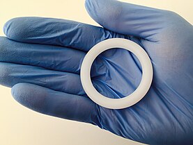 A picture showing a silicone ring identical to the Dapivirine Ring used in the ASPIRE trial. Vaginal Ring (25153111944).jpg