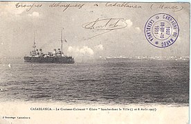 A postcard showing the French cruiser Gloire recoiling from firing artillery at the city during the bombardment of Casablanca August 1907.