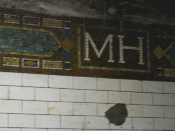 The Mott Haven Avenue "MH" Mosaics along one of the platforms.