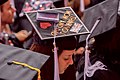 A Student Reviews Her Program Before Secretary Delivering the Commencement Address for Northeastern University's Class of 2016 in Boston (26819142186).jpg
