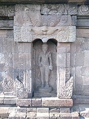 Agastya on south side of the 9th-century Javanese Sambisari temple unearthed from volcanic mud. Agastya statue in southern niche of Sambisari temple.jpg