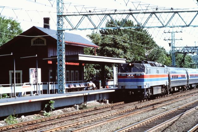 Amtrak E60CH No. 960 pulls a train through Cos Cob, Connecticut in September 1975