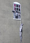 "Naken man" av Banksy, i Park Street, Bristol. Efter stort folkligt stöd beslutade stadsfullmäktige att låta den vara kvar.