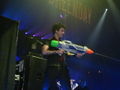 Billie Joe in concert with a water gun