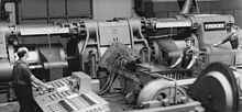1970 East Berlin: workers in VEB Kabelwerk Oberspree producing aluminum wires with a SKET-built machine Bundesarchiv Bild 183-J0416-0012-001, VEB Kabelwerk Oberspree, Doppelstempelpresse.jpg