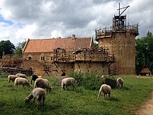 The Guedelon Castle in France is a castle currently being built using only medieval construction techniques, tools, costumes and local materials. Chateau de Guedelon (France) en mai 2014 et moutons.jpg