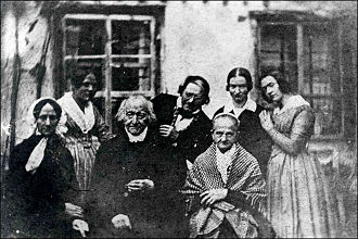 1840 daguerreotype reportedly showing Constanze Mozart (see text for serious doubts), front on the far left, two years before her death; Bavarian composer Max Keller [de] is seated center front and to his left is his wife, Josefa; from left to right in rear are the family cook, Philip Lattner (Keller's brother in law), and Keller's daughters, Luise and Josefa; the image was first brought to scholarly attention in 1958.[22]