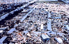 An aerial view of destroyed mobile homes with copious amounts of debris