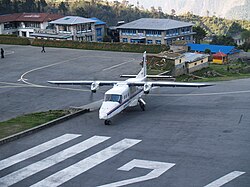 Gorkha Airlines Dornier 228 at Lukla Airport Do 228 at VNLK turns around on the runway.jpg