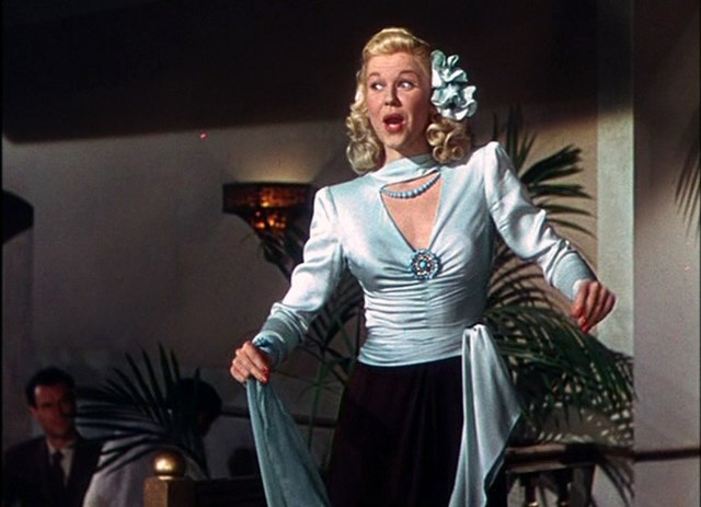 Doris Day as Georgia Garrett, singing "I'm in Love".